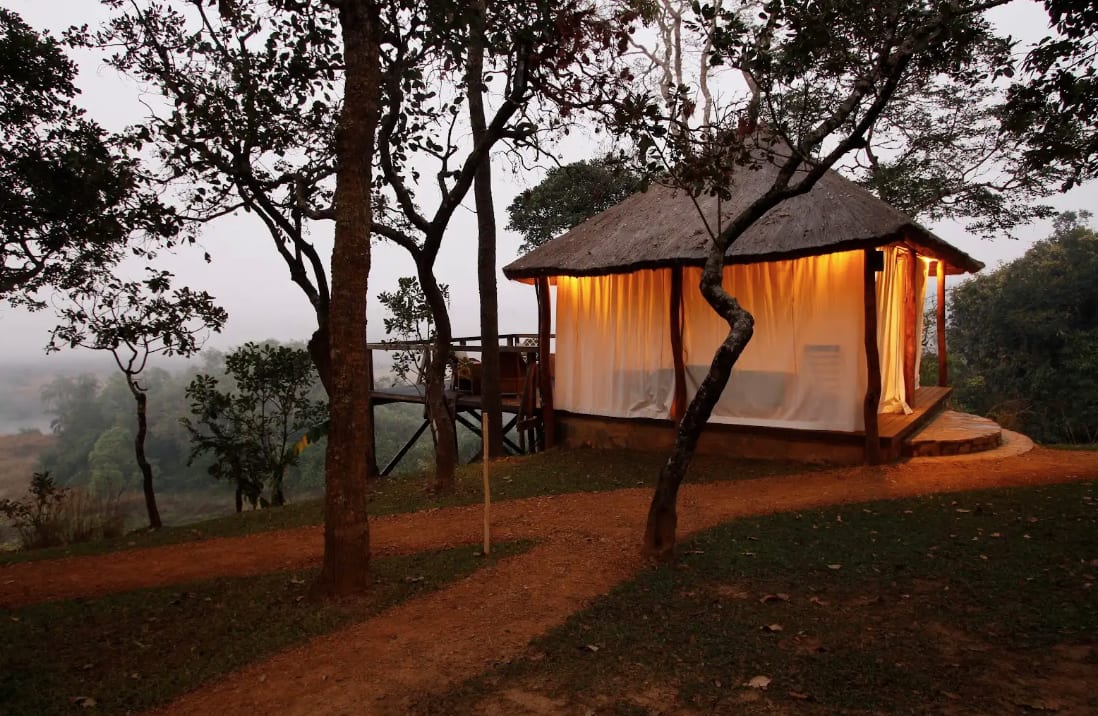 Luxury tent at dusk overlooking the river valley
