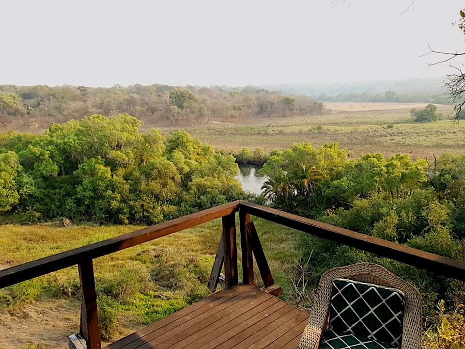 Camp: Thatched lounge deck overlooking the conservancy