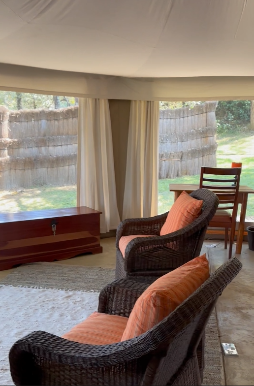 Tent lounge with armchairs looking out to the plains